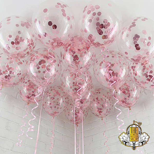 Pretty pink ceiling confetti balloons delivery by Oscar's Den - The London Balloon Shop.